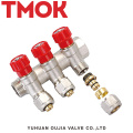 brass color four-way water manifold